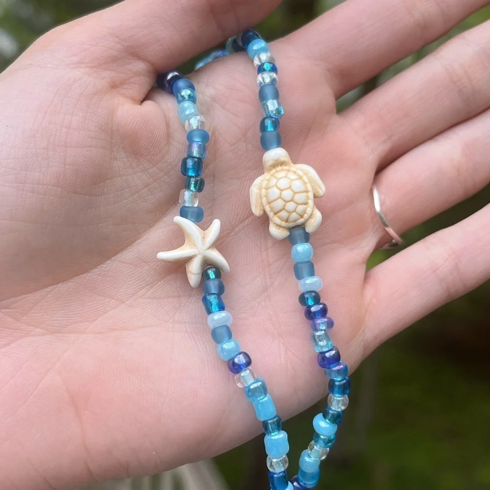 Handmade pack of matching blue beaded bracelets beach theme gold turtle starfish